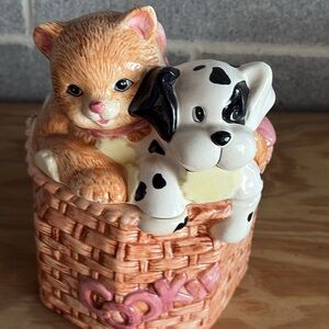 Cute kitten cat and dalmatian puppy sitting on porcelain with letter Cookie